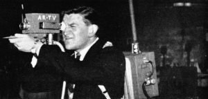 A man with a portable camera